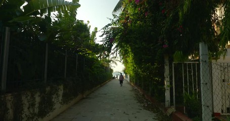 Locals hangout in the picturesque alleys of Stone town. Zanzibar, Africa.