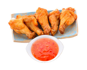 Fried chicken and sauce on a white background.