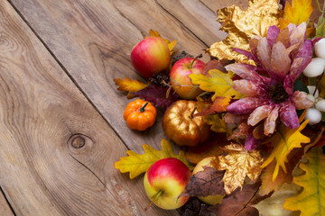 Thanksgiving background with golden pumpkin and oak leaves, copy space