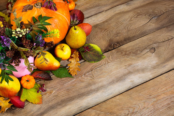 Obraz na płótnie Canvas Thanksgiving background with ripe pumpkin, pears and fall leaves