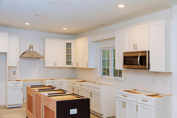 Installing new induction hob in modern kitchen