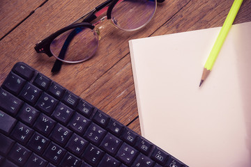 Top view of notebook pape on Office desk table.