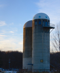Twin silos towering