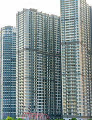 Obraz na płótnie Canvas Ho Chi Minh City, Vietnam - November 30th, 2017: Skyscrapers viewed from below towards sky represents urban development with modern architecture to bring international in Ho Chi Minh City, Vietnam