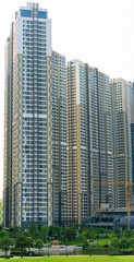 Fototapeta premium Ho Chi Minh City, Vietnam - November 30th, 2017: Skyscrapers viewed from below towards sky represents urban development with modern architecture to bring international in Ho Chi Minh City, Vietnam