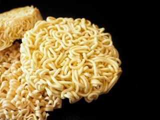 Dry instant noodle on black background