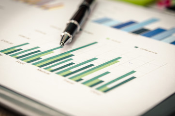 Financial graphs  and pen