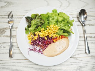Fresh vegetable salad with dressing