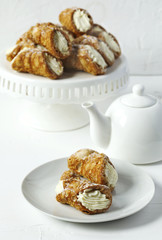 Traditional dessert Cannoli Siciliani stuffed with ricotta cream