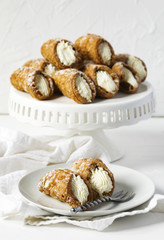 Traditional dessert Cannoli Siciliani stuffed with ricotta cream