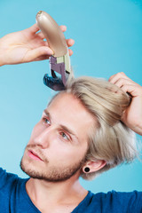 Man going to shave his long hair