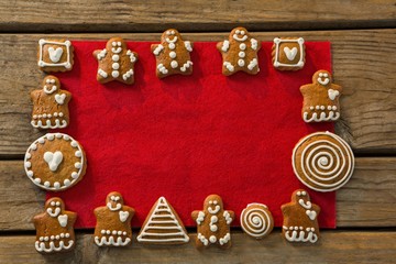 Overhead view of gingerbread cookies arranged on fabric