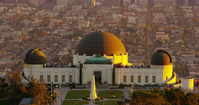 Telephoto shot of The Griffith Observatory and LA skyline in the distance in Los Angeles, California.