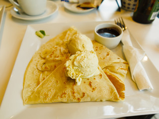 Pancake with ice cream and chocolate sauce