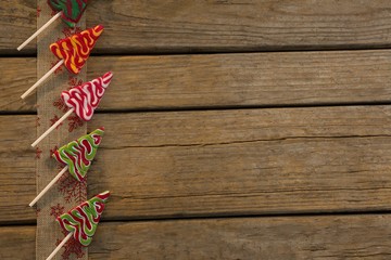 Overhead view of mint candies arranged on embroidered burlap