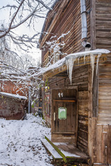 Porch of wooden house in winter frost