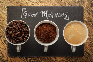 Three cups of coffee. Good morning. The view from the top. Beans, ground coffee and ready to drink. Three States of preparation.