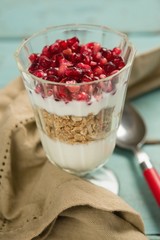 Cup of yogurt with raspberry and pomegranate