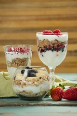 Cup of cereals with fruits and yogurt