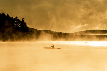 Canada Ontario Lake of two rivers Canoe Canoes foggy water sunrise fog golden hour on water in Algonquin National Park