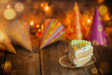 birthday cake on plate on wooden table