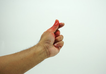 Mini hart posture of Men's hand stained with red color on white background