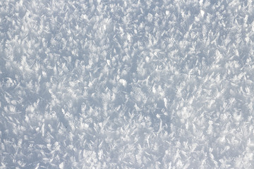 Close-up macro photo of frost and snow crystals