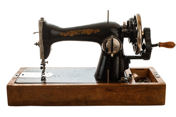 Old sewing machine on white background.
