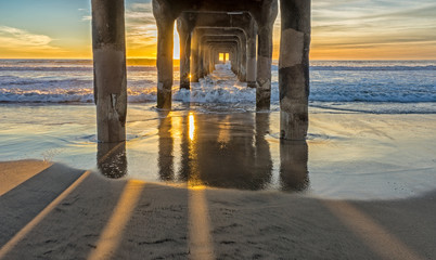 sunset under the pier