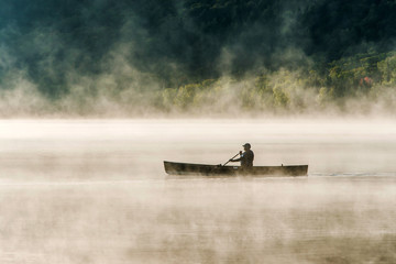 Canada Ontario Lake of two rivers Canoe Canoes foggy water sunrise fog golden hour on water in...