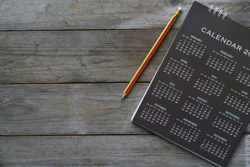 close up of calendar and pencil on the table, planning for business meeting or travel planning...