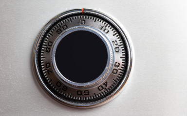 Closed up image of steel safe dial lock.