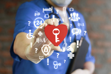 Doctor holding red heart with key icon on virtual interface. Healthcare Secure concept. Open Secure Medical Data. Trust and love of medicine. Health Care Assistance Center. Secret Healthy Life Style.