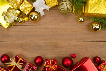 Red and gold of many gift box on wooden background for Christmas concept