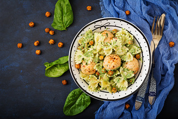 Farfalle pasta with meatballs and spinach  sauce with fried chickpeas. Proper nutrition. Sports...