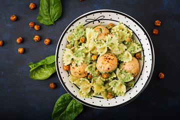 Farfalle pasta with meatballs and spinach  sauce with fried chickpeas. Proper nutrition. Sports nutrition. Dietary menu. Flat lay. Top view