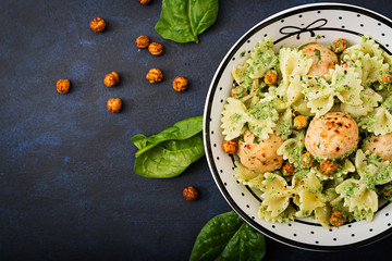 Farfalle pasta with meatballs and spinach  sauce with fried chickpeas. Proper nutrition. Sports nutrition. Dietary menu. Flat lay. Top view