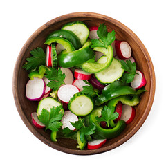Fresh salad of cucumbers, radishes, green peppers and parsley. Flat lay. Top view