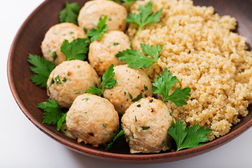Baked meatballs of chicken fillet with garnished with quinoa. Flat lay. Top view. Proper nutrition. Sports nutrition. Dietary menu