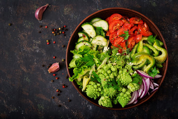 Vegan salad of fresh vegetables and cabbage romanesko. Dietary menu. Proper nutrition. Flat lay. Top view