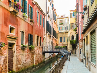 Fototapeta na wymiar Venetian channel, ancient bridge and buildings. Venice, Italy