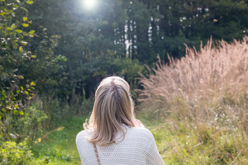 The girl makes a wish and blows down