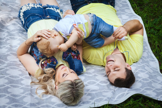 happy family resting in park