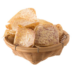 fried Taro slices Dip into the caramel In the basket isolated on white background