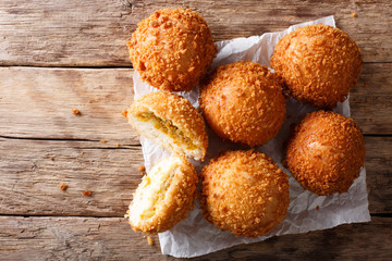 Homemade Japanese bread stuffed with curry kare pan macro on paper. horizontal top view