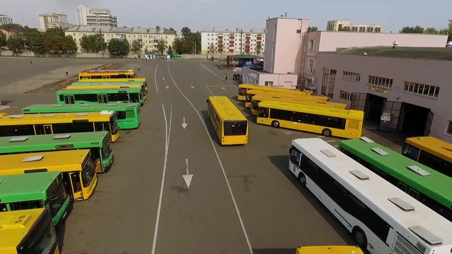 Transportation, view from height, the buses leave for the road, bus parking.
