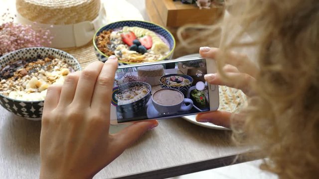 Female Blogger Taking Pictures Of Hipster Breakfast With Phone. Closeup. 4K. 