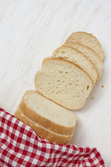 Freshly baked bread on white wooden table with Tablecloth and copy space