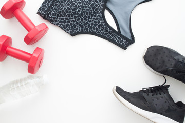 Flat lay of sport equipments on white background