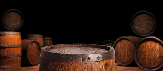 Fototapeten Rustic wooden barrel on a night background © arsenypopel